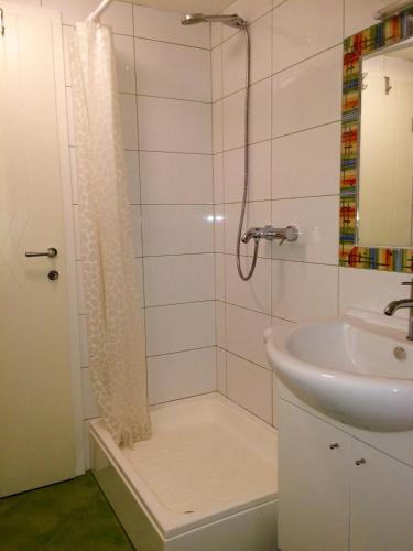 a bathroom with a shower and a sink at Apartments Brčić in Kaštela