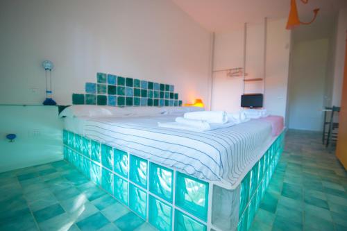 Suite House L'Isola Che Non C'èにあるベッド
