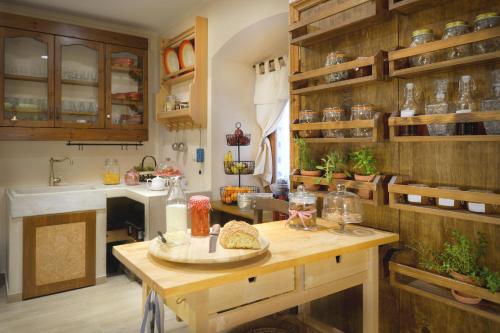 a kitchen with a table with food on it at Locandiera in Corfu Town