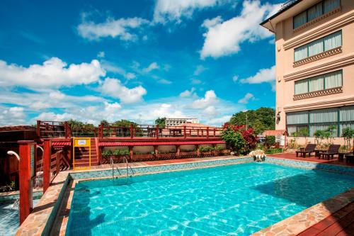a swimming pool on the roof of a hotel at Sea Passion Hotel in Koror