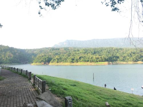 a view of a body of water with mountains in the background at Baan Suan Kru Kob in Ban Ko Maphang