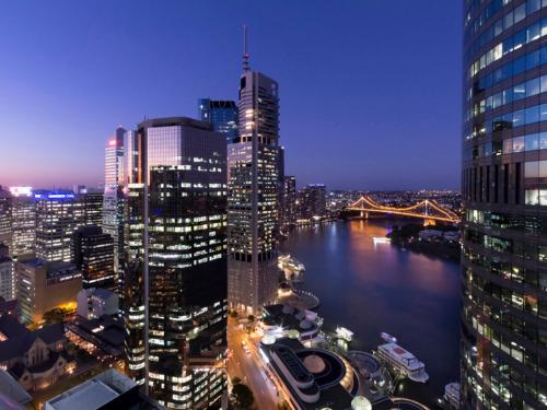 a view of a city skyline at night at Felix 374 FF Apartment in Brisbane