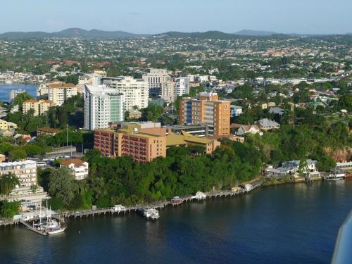 an aerial view of a city with a river and buildings at Felix 374 FF Apartment in Brisbane