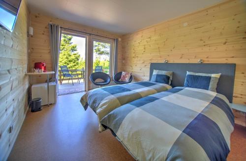 Postel nebo postele na pokoji v ubytování Hamgården Nature Resort Tiveden