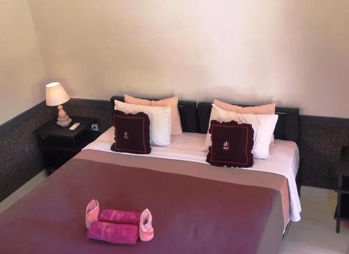 Postel nebo postele na pokoji v ubytování Doubleyou Homestay Pemuteran