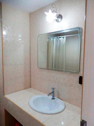 a bathroom with a sink and a mirror at Jomtien beach Condominium S2 in Jomtien Beach