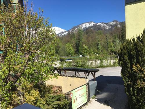a view of a road with mountains in the background at Apartment Haus Braumandl in Bad Ischl