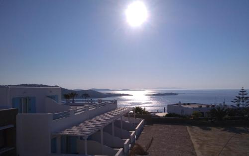 a view of the ocean from a balcony of a building at Eternal Suites in Mýkonos City