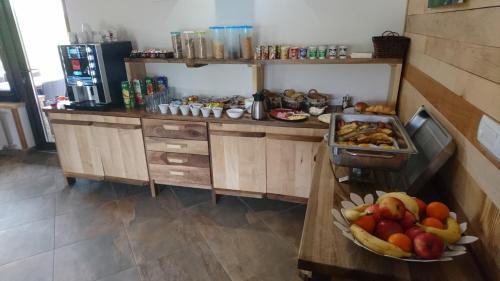 a kitchen with a bowl of fruit on a counter at Villa Stone in Rakovica