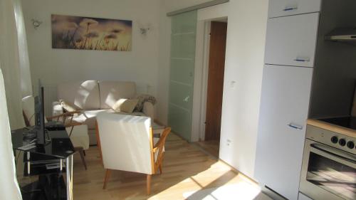 a room with a kitchen and a living room at Wohnung am See in Steinbach am Attersee