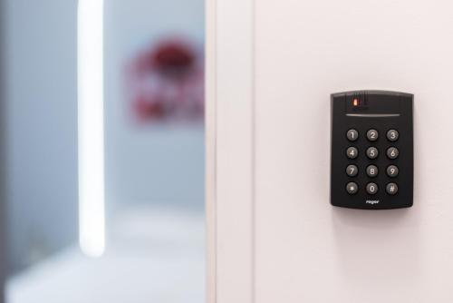 a door with a remote control attached to it at Sopot Host Patio in Sopot