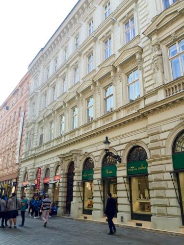 a large building with people walking in front of it at Paul's palace - absolute center! in Bratislava