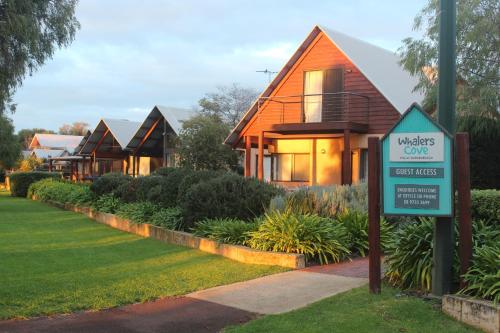 a sign in front of a house at Whalers Cove Villas in Dunsborough