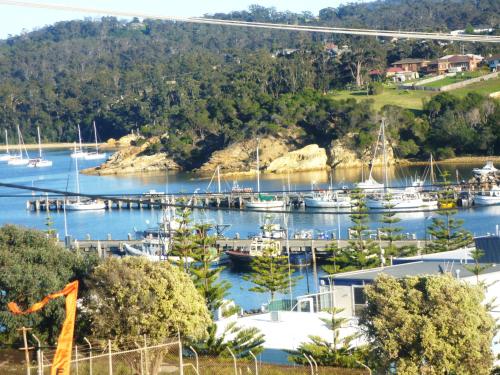 a marina with boats docked in the water at Snug Cove Villas in Eden
