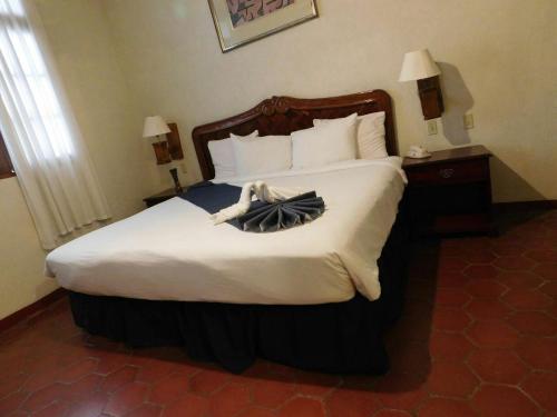 Postel nebo postele na pokoji v ubytování Hotel Urdiñola Saltillo