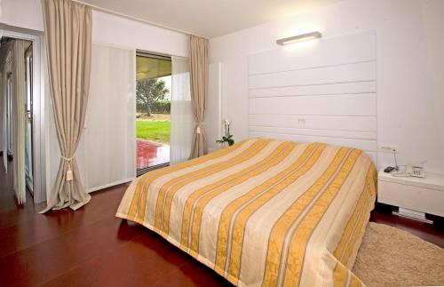 Posteľ alebo postele v izbe v ubytovaní Ladanjsko Imanje Principovac