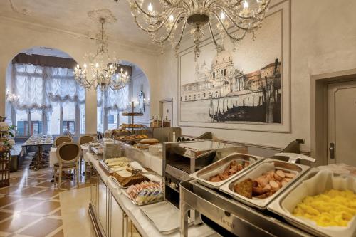 a buffet line with many different types of food at Hotel Ca' dei Conti in Venice