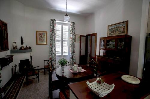a living room with a table and a dining room at Villa Daura in Riccò del Golfo di Spezia