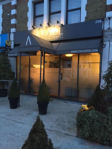 a building with an umbrella in front of it at Lyall Apartment Hotel in London