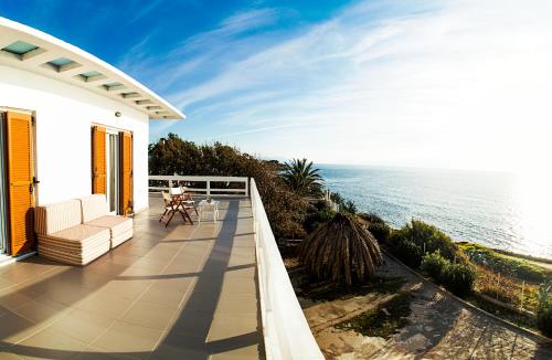 a balcony of a house with a view of the ocean at Villa Moby Dick in Mitikas