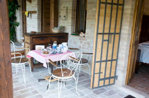a table and chairs sitting on a patio at Casa della Strega in Montegiorgio