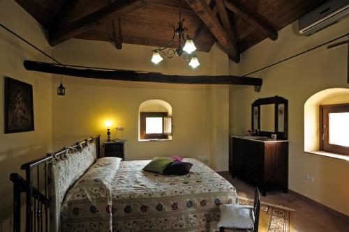 Tempat tidur dalam kamar di Agriturismo Villa Vittoria