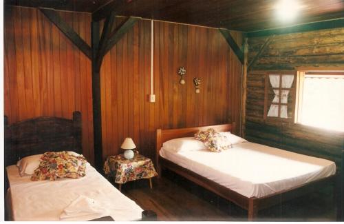 Katil atau katil-katil dalam bilik di Hotel Vale das Hortênsias