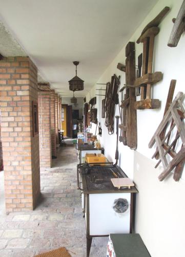 a row of tables lined up against a wall at Bike Stop Duna in Dunaszentmiklós