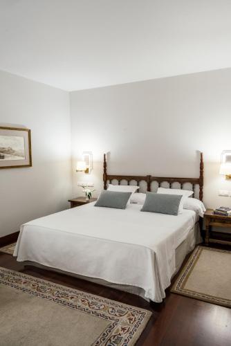 Кровать или кровати в номере Parador de Baiona