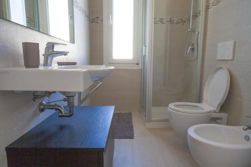 a bathroom with a sink and a toilet and a shower at Casa Marco - Villa alle Cascine - Imperia in Imperia