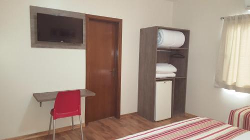 Postel nebo postele na pokoji v ubytování Hotel Recanto