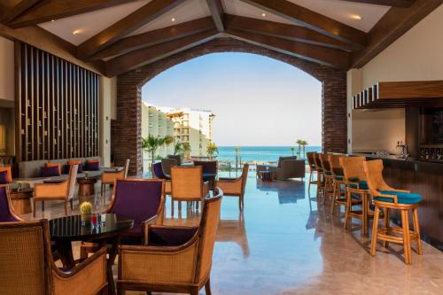 a restaurant with a view of the ocean at Krystal Grand Los Cabos - All Inclusive in San José del Cabo