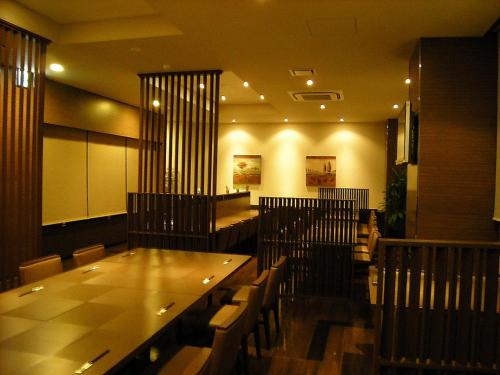 a dining room with a long table and chairs at Hotel Route-Inn Seki in Sekimachi