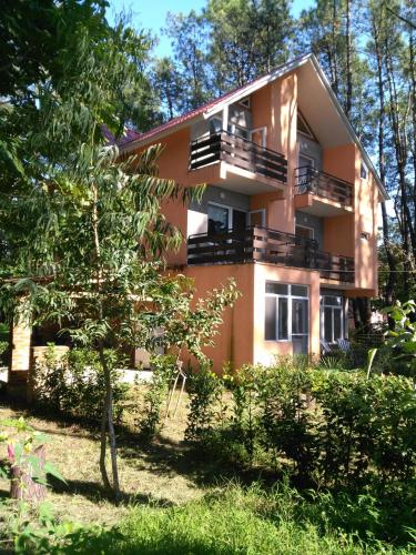 a building with balconies on the side of it at Villa Vachnadze in Shekvetili