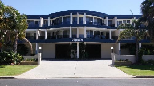 a large blue building with a sign on it at Apollo Apartments Merimbula in Merimbula