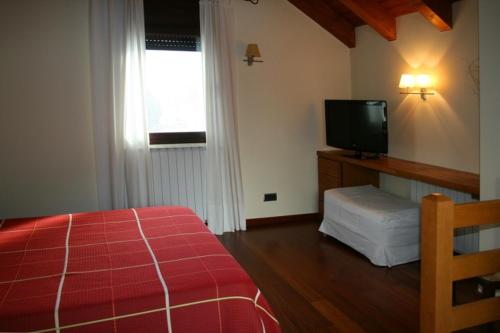 Posteľ alebo postele v izbe v ubytovaní Apartamentos Les Picardes