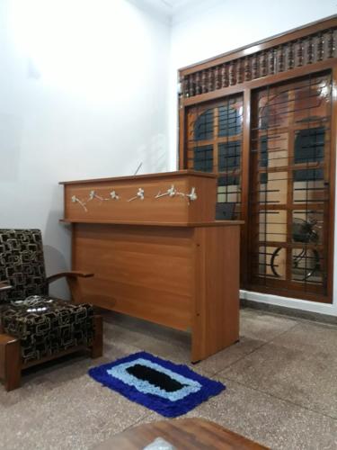 a podium in a room with a chair and a window at Brinthavanam Days Inn in Jaffna