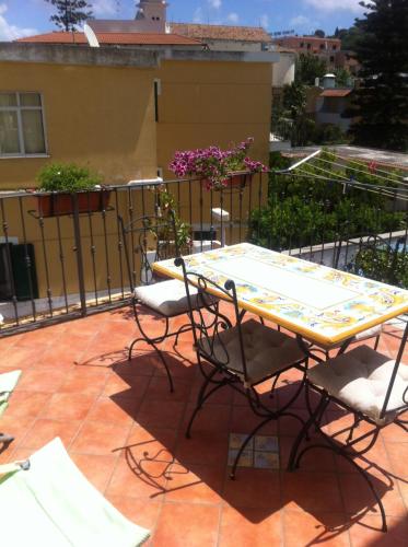 a table and chairs sitting on a patio at Excelsior Mare Suite in Ischia