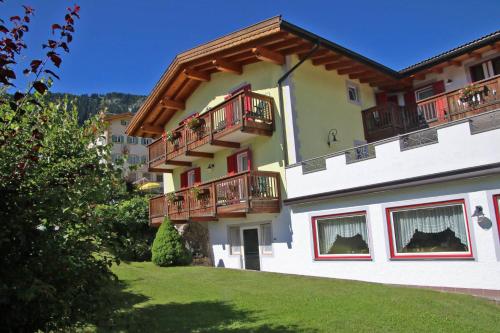 a building with balconies on the side of it at Hotel Vigo in Vigo di Fassa