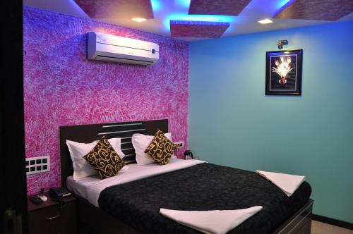 Ένα ή περισσότερα κρεβάτια σε δωμάτιο στο Hotel Planet Plaza