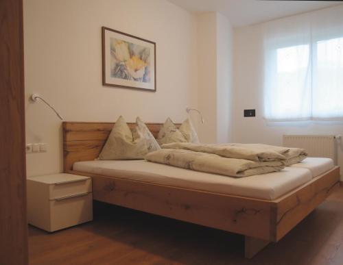 Postel nebo postele na pokoji v ubytování Ausserdorfer Apartments