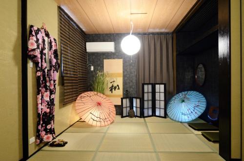 a hallway with three umbrellas on the floor at South Island in Itoman