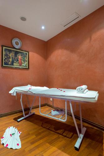 a room with a table with a phone in it at Kennedy Hospitality Resort in Marrakech