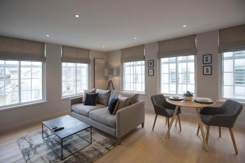 a living room with a couch and a table at No.8 Waterloo Street in Birmingham
