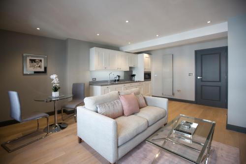 a living room with a couch and a table at No.8 Waterloo Street in Birmingham