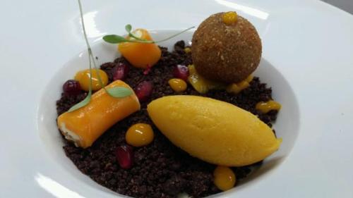 a bowl of food with fruits and vegetables on a plate at Hostellerie Saint Germain in Saint-Germain-lès-Arlay