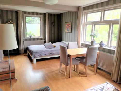 Postel nebo postele na pokoji v ubytování B&B De Ark