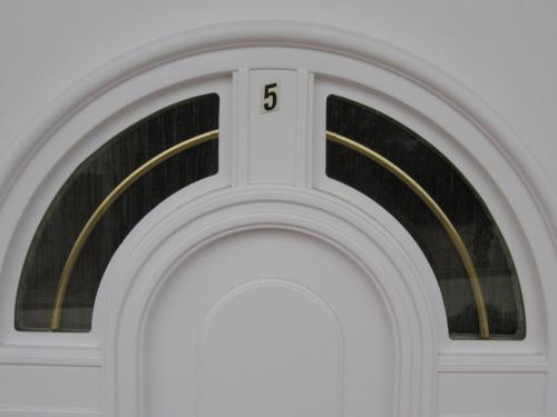 a white door with the number on it at Apartments Stengl in Rab
