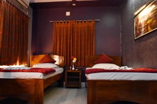 Una cama o camas en una habitación de Hotel Gateway Continental