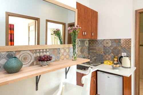 a kitchen with a sink and a counter top at Blue Sky Apartment in Krakow